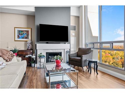 Ph6-2175 Marine Drive, Oakville, ON - Indoor Photo Showing Living Room With Fireplace