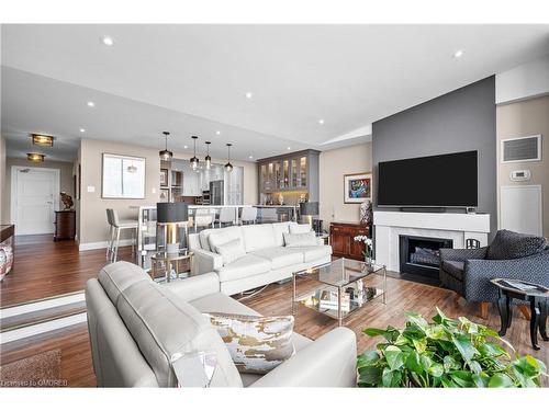 Ph6-2175 Marine Drive, Oakville, ON - Indoor Photo Showing Living Room With Fireplace