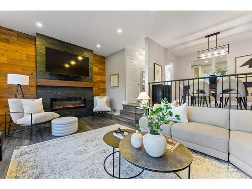 179-2050 Upper Middle Road, Burlington, ON - Indoor Photo Showing Living Room With Fireplace