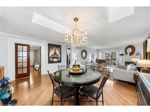 15-2155 Duncaster Drive, Burlington, ON - Indoor Photo Showing Dining Room With Fireplace