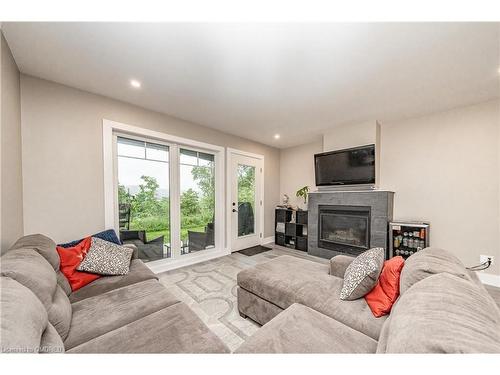 102-4 Tree Tops Lane, Huntsville, ON - Indoor Photo Showing Living Room With Fireplace