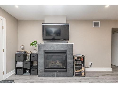 102-4 Tree Tops Lane, Huntsville, ON - Indoor Photo Showing Living Room With Fireplace