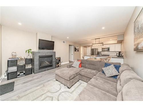 102-4 Tree Tops Lane, Huntsville, ON - Indoor Photo Showing Living Room With Fireplace