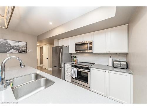 102-4 Tree Tops Lane, Huntsville, ON - Indoor Photo Showing Kitchen With Double Sink