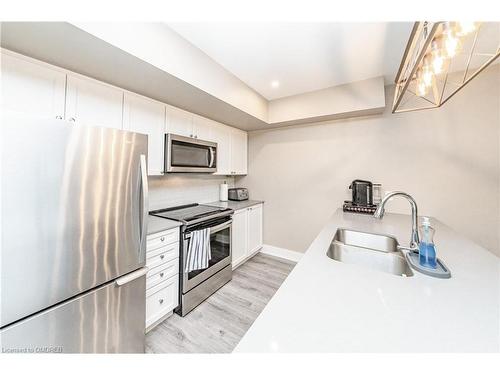 102-4 Tree Tops Lane, Huntsville, ON - Indoor Photo Showing Kitchen With Double Sink