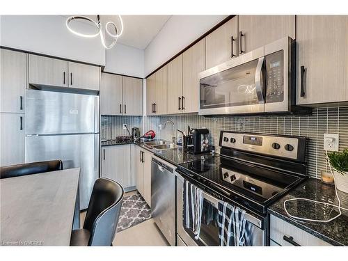 1313-55 Speers Road, Oakville, ON - Indoor Photo Showing Kitchen With Stainless Steel Kitchen With Double Sink