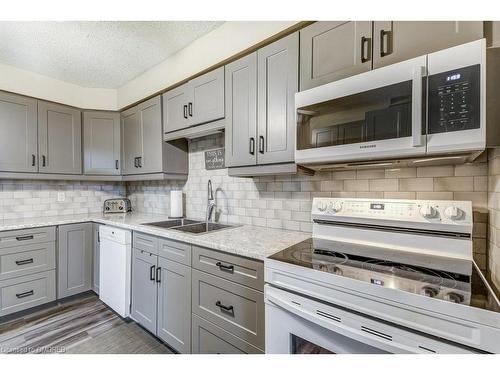 302-6 Shettleston Drive, Cambridge, ON - Indoor Photo Showing Kitchen With Double Sink