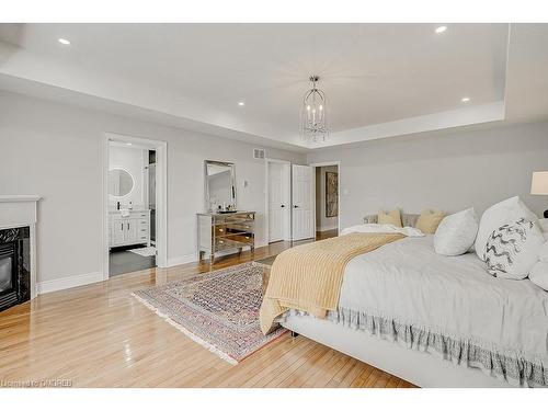 2-128 Morden Road, Oakville, ON - Indoor Photo Showing Bedroom With Fireplace