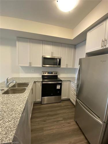 513-1581 Rose Way, Milton, ON - Indoor Photo Showing Kitchen With Stainless Steel Kitchen With Double Sink