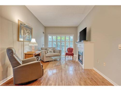 316-2085 Amherst Heights Drive, Burlington, ON - Indoor Photo Showing Living Room With Fireplace