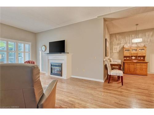 316-2085 Amherst Heights Drive, Burlington, ON - Indoor Photo Showing Living Room With Fireplace