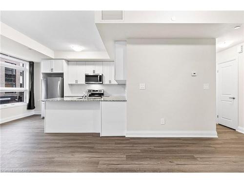 117-1569 Rose Way, Milton, ON - Indoor Photo Showing Kitchen With Stainless Steel Kitchen With Upgraded Kitchen