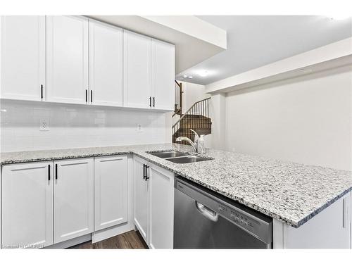 117-1569 Rose Way, Milton, ON - Indoor Photo Showing Kitchen With Double Sink With Upgraded Kitchen