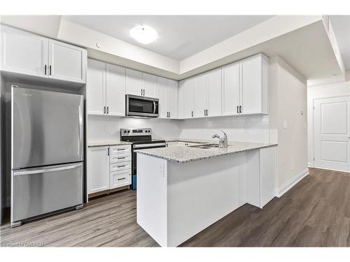 117-1569 Rose Way, Milton, ON - Indoor Photo Showing Kitchen With Stainless Steel Kitchen With Upgraded Kitchen