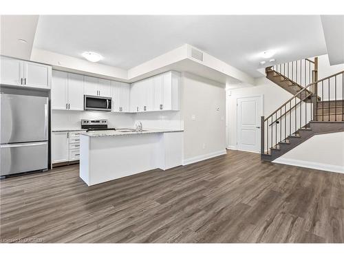 117-1569 Rose Way, Milton, ON - Indoor Photo Showing Kitchen With Stainless Steel Kitchen With Upgraded Kitchen