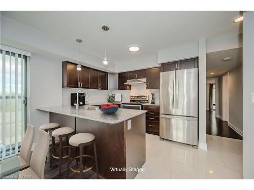 718-138 Widdicombe Hill Boulevard, Etobicoke, ON - Indoor Photo Showing Kitchen With Stainless Steel Kitchen