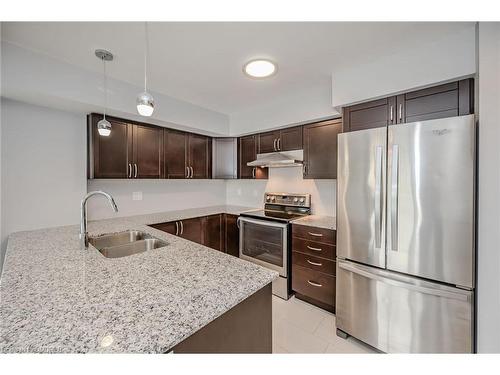 718-138 Widdicombe Hill Boulevard, Etobicoke, ON - Indoor Photo Showing Kitchen With Stainless Steel Kitchen With Double Sink