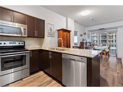 1306-65 Speers Road, Oakville, ON - Indoor Photo Showing Kitchen With Stainless Steel Kitchen