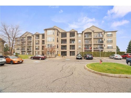 304-1479 Maple Avenue, Milton, ON - Outdoor With Balcony With Facade