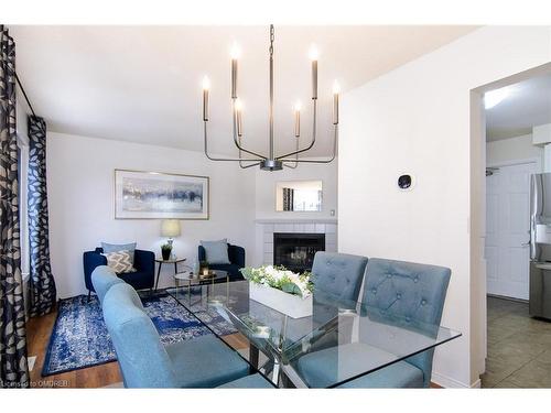 6-79 Braeheid Avenue Avenue, Waterdown, ON - Indoor Photo Showing Dining Room With Fireplace