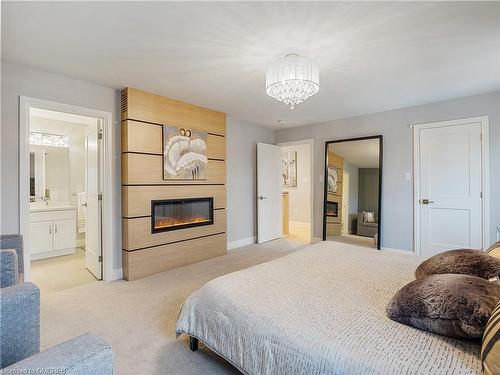 395 Klein Circle, Ancaster, ON - Indoor Photo Showing Bedroom With Fireplace