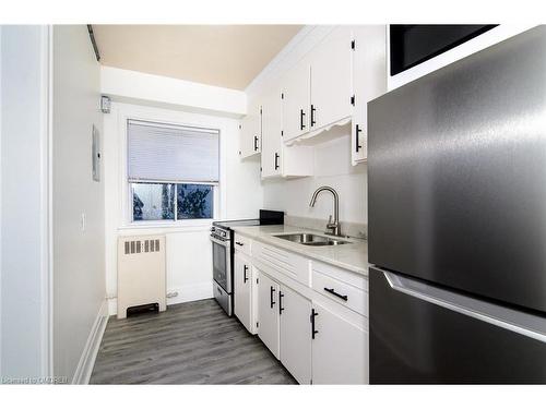 2-145 Victoria Avenue S, Hamilton, ON - Indoor Photo Showing Kitchen With Double Sink