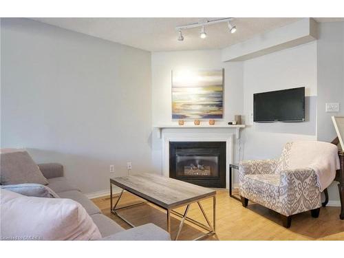 21-2940 Headon Forest Drive, Burlington, ON - Indoor Photo Showing Living Room With Fireplace