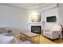 21-2940 Headon Forest Drive, Burlington, ON  - Indoor Photo Showing Living Room With Fireplace 