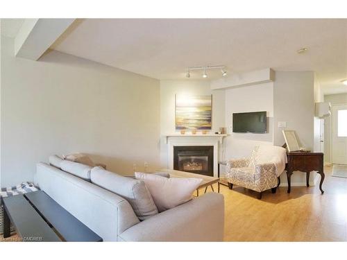 21-2940 Headon Forest Drive, Burlington, ON - Indoor Photo Showing Living Room With Fireplace