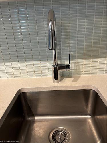 209-65 Speers Road, Oakville, ON - Indoor Photo Showing Kitchen With Double Sink