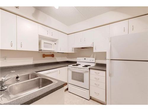 306-1460 Bishops Gate, Oakville, ON - Indoor Photo Showing Kitchen With Double Sink