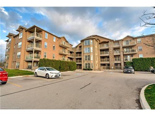 306-1460 Bishops Gate, Oakville, ON - Outdoor With Balcony With Facade