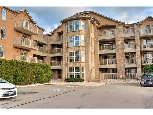 306-1460 Bishops Gate, Oakville, ON - Outdoor With Balcony With Facade