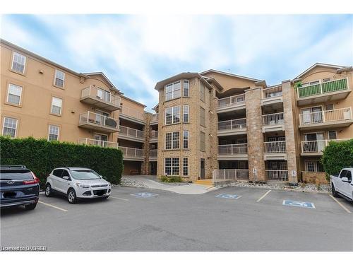 306-1460 Bishops Gate, Oakville, ON - Outdoor With Balcony With Facade