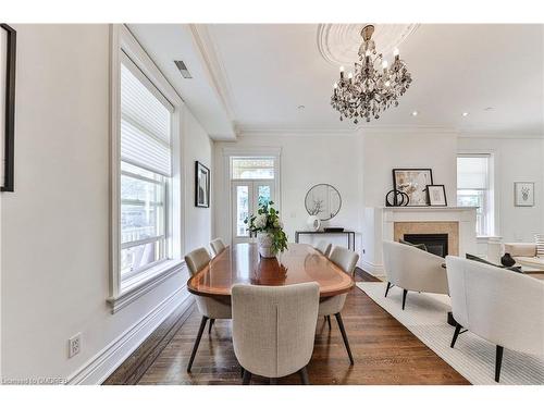 5-32 Gothic Avenue, Toronto, ON - Indoor Photo Showing Dining Room With Fireplace