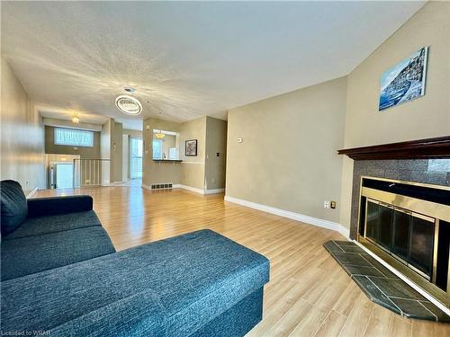 2-240 Highland Crescent, Kitchener, ON - Indoor Photo Showing Living Room With Fireplace