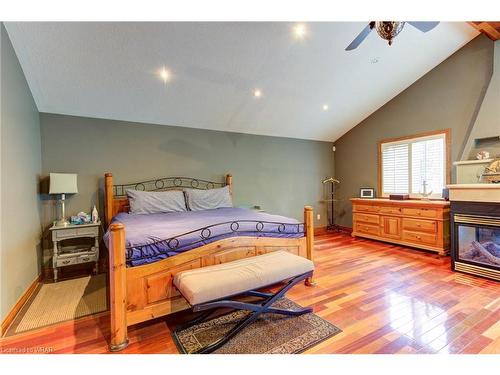 310 River Road E, Wasaga Beach, ON - Indoor Photo Showing Bedroom With Fireplace
