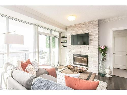 706-150 Wellington Street E, Guelph, ON - Indoor Photo Showing Living Room With Fireplace