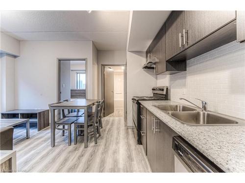 B404-275 Larch Street, Waterloo, ON - Indoor Photo Showing Kitchen With Double Sink