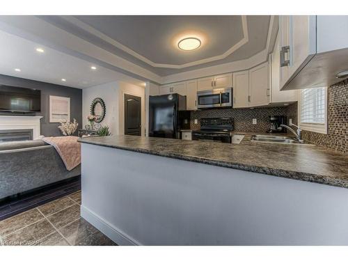 27 Upper Mercer Street, Kitchener, ON - Indoor Photo Showing Kitchen With Fireplace With Double Sink