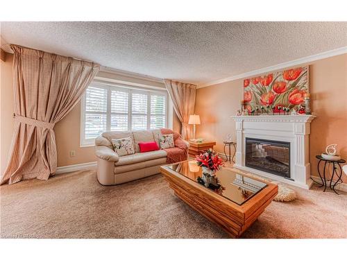 83 The Greenway Way, Cambridge, ON - Indoor Photo Showing Living Room With Fireplace