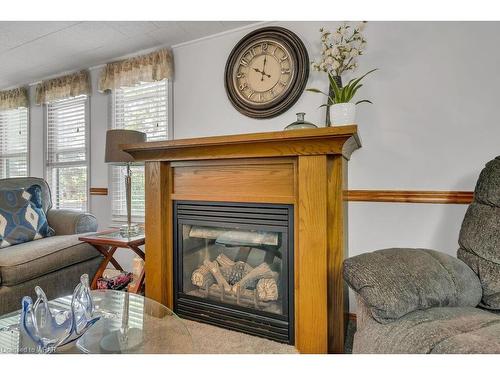 9-580 Beaver Creek Road, Waterloo, ON - Indoor Photo Showing Living Room With Fireplace