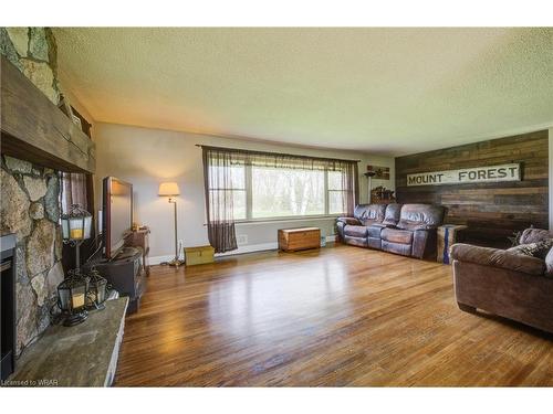 298 London Road S, Mount Forest, ON - Indoor Photo Showing Living Room With Fireplace