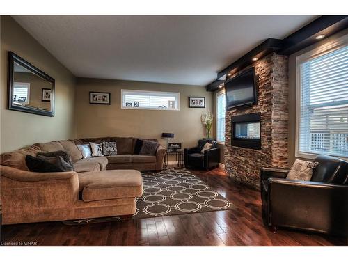 1-550 Altheim Crescent, Waterloo, ON - Indoor Photo Showing Living Room With Fireplace