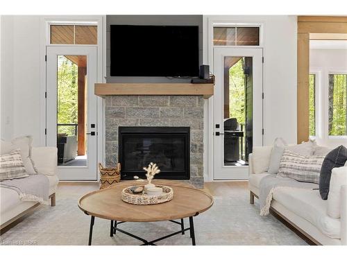 14 St Georges Court, Huntsville, ON - Indoor Photo Showing Living Room With Fireplace