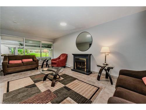 403-58 Bridgeport Road, Waterloo, ON - Indoor Photo Showing Other Room With Fireplace