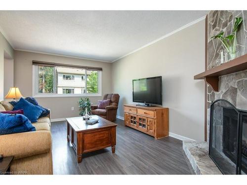 32-30 Green Valley Drive, Kitchener, ON - Indoor Photo Showing Living Room With Fireplace