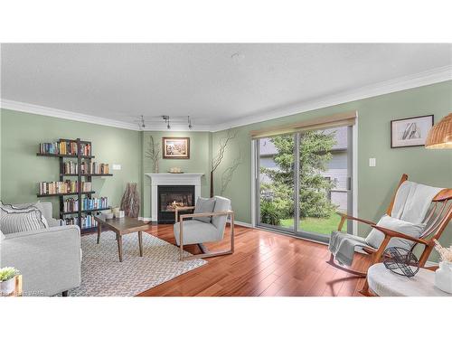 37-1499 Byron Baseline Road, London, ON - Indoor Photo Showing Living Room With Fireplace