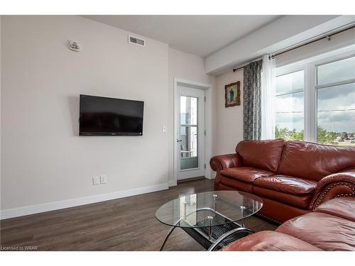 210-175 Commonwealth Street, Kitchener, ON - Indoor Photo Showing Living Room