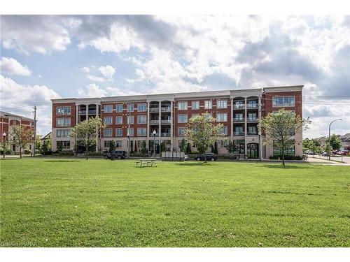 210-175 Commonwealth Street, Kitchener, ON - Outdoor With Balcony With Facade